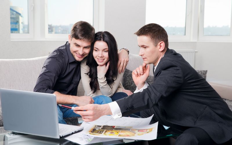 Real Estate Agent  in discussion with clients